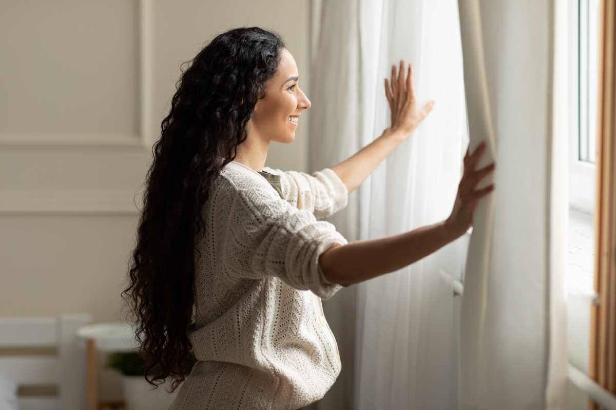how to deal with depression white woman smiling at window