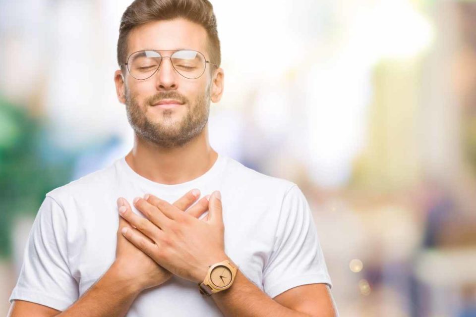 man holding chest anxiety breathing techniques
