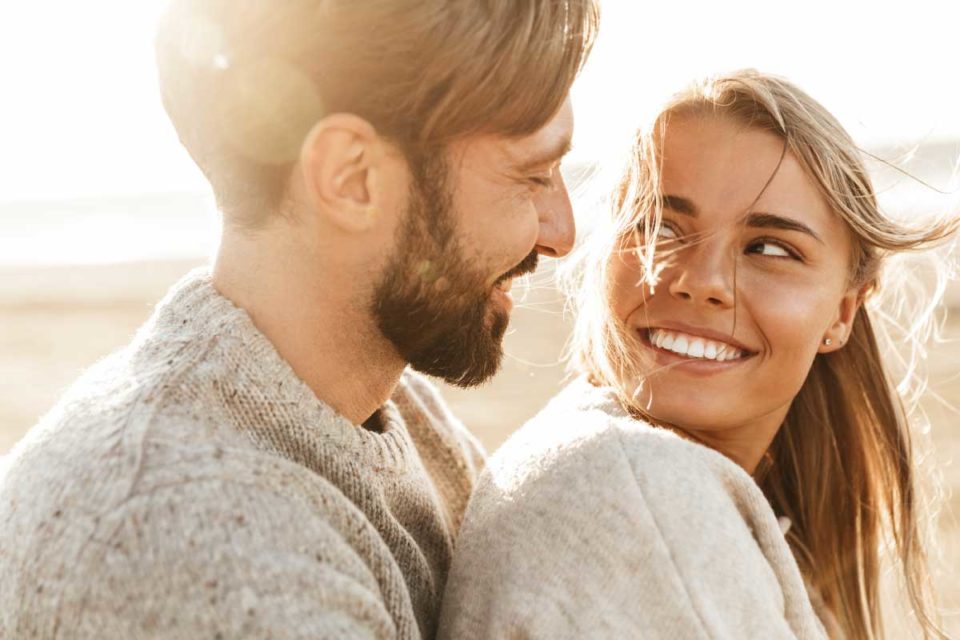 white man hugging white woman from behind smiling at each other how to set healthy boundaries in relationships