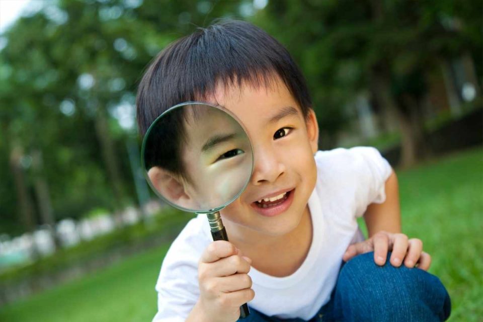 young asian boy with magnifying glass how parents speak so children listen