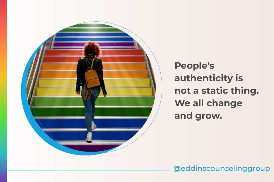 woman walking up rainbow stairs