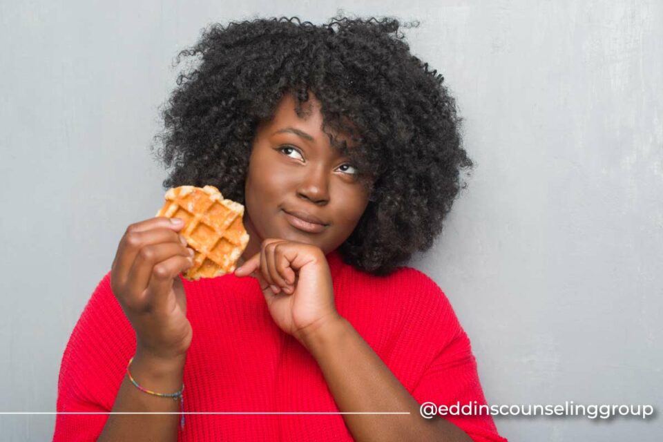 black woman eating a waffle