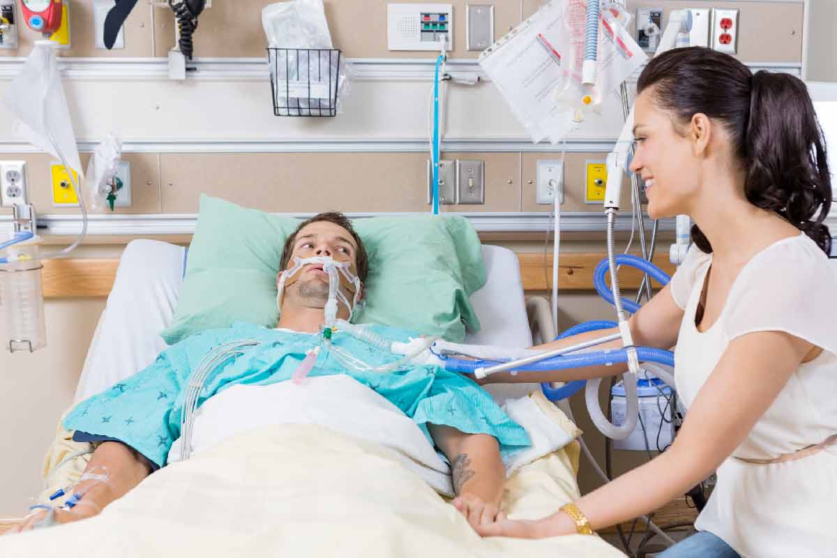 scared man in hospital bed medical trauma