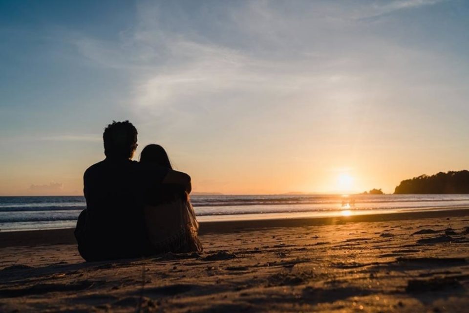 17 Social Distancing Date Night Activities couple on beach at sunset