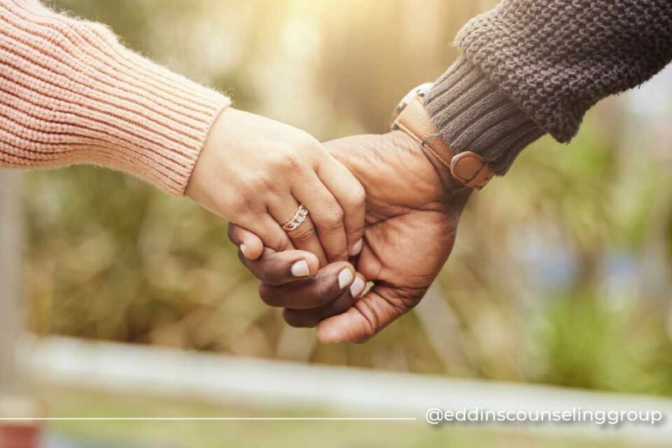 couple holding hands premarital counseling
