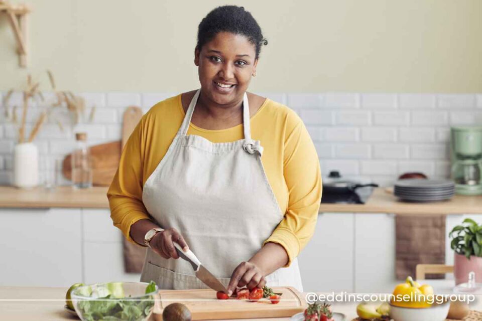 woman cutting tomatoes healing from an eating disorder