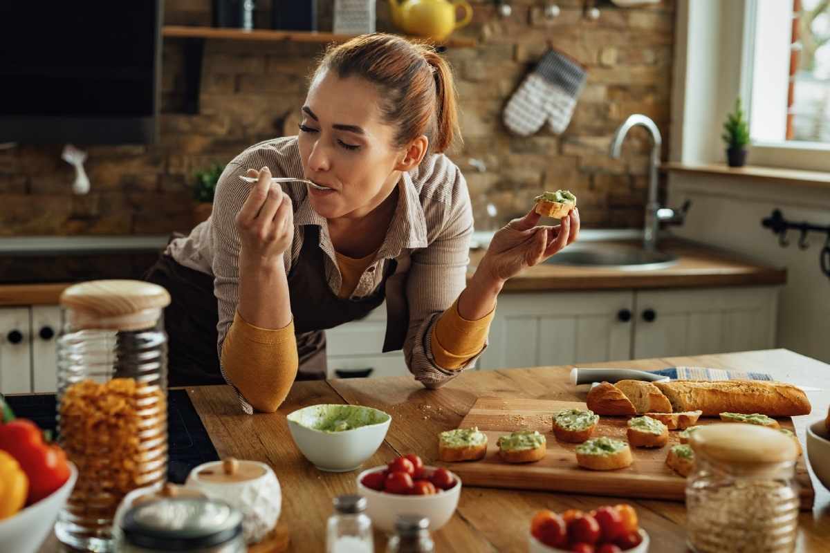 white woman eating and enjoying the food intuitive eating
