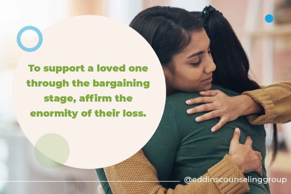 two loved ones hugging while dealing with grief in the bargaining stage of acceptance and grief