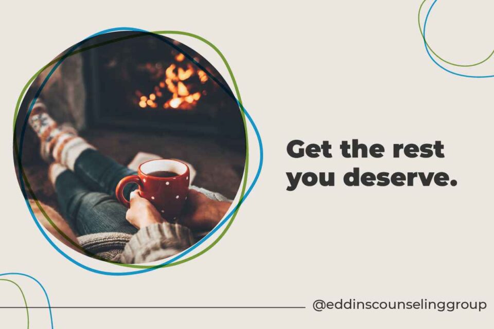 get the rest you deserve person in front of fireplace with mug