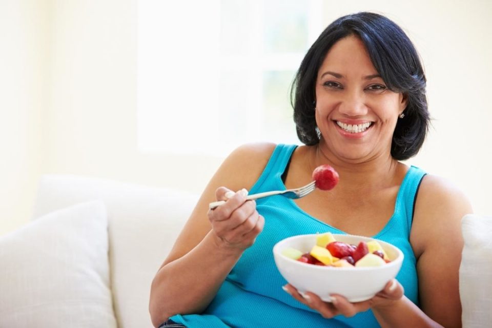 recovery from an Eating Disorder woman eating fruit