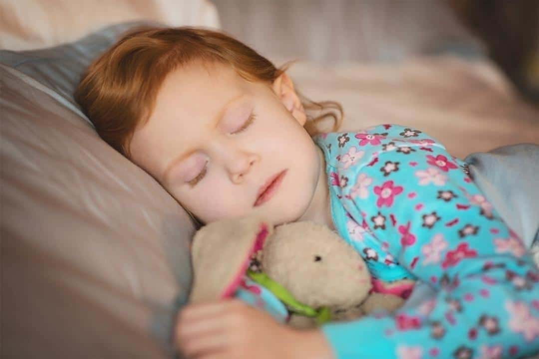 Autism Insomnia white child sleeping with teddy bear