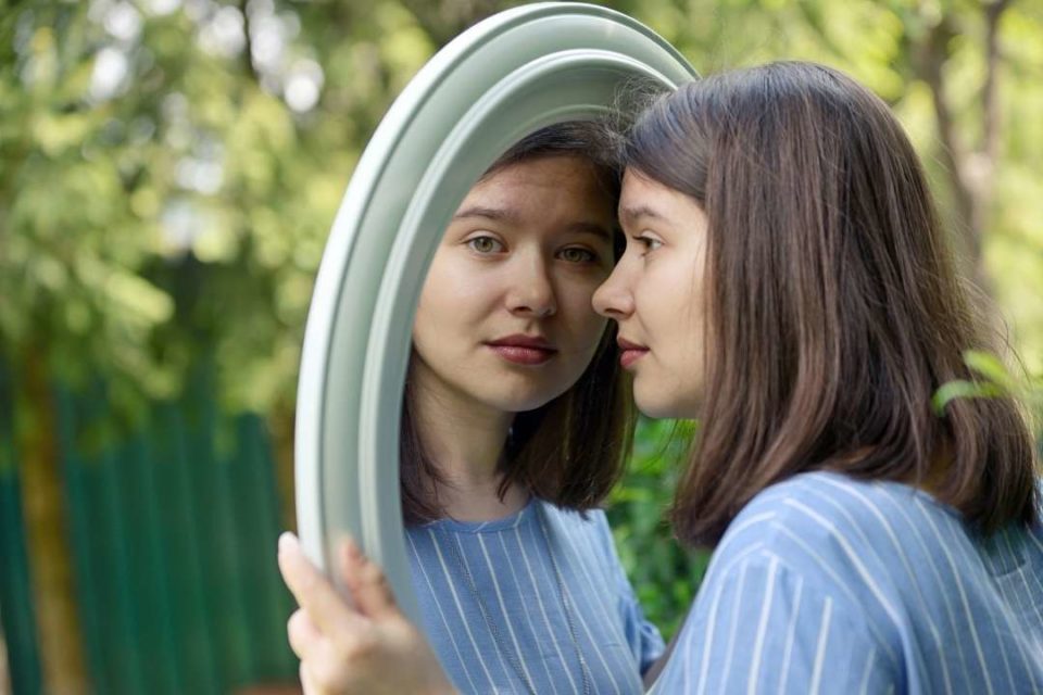 young woman in mirror 
