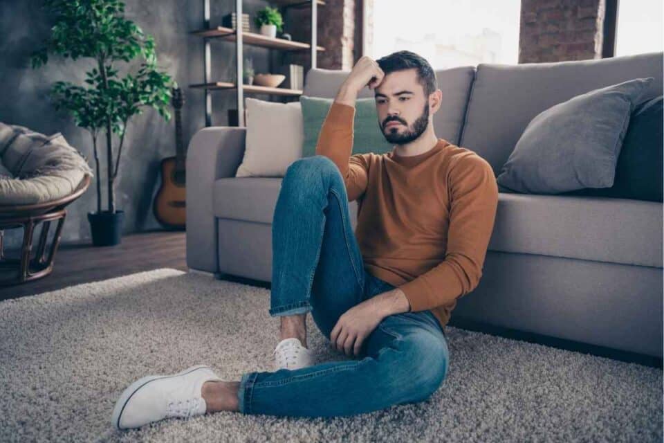 Man experiencing emotional triggers that keep him stuck in unhealthy coping cycles
