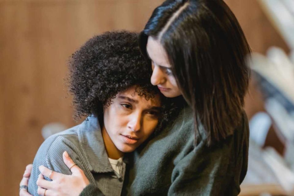 mom comforting biracial daughter dealing with grief