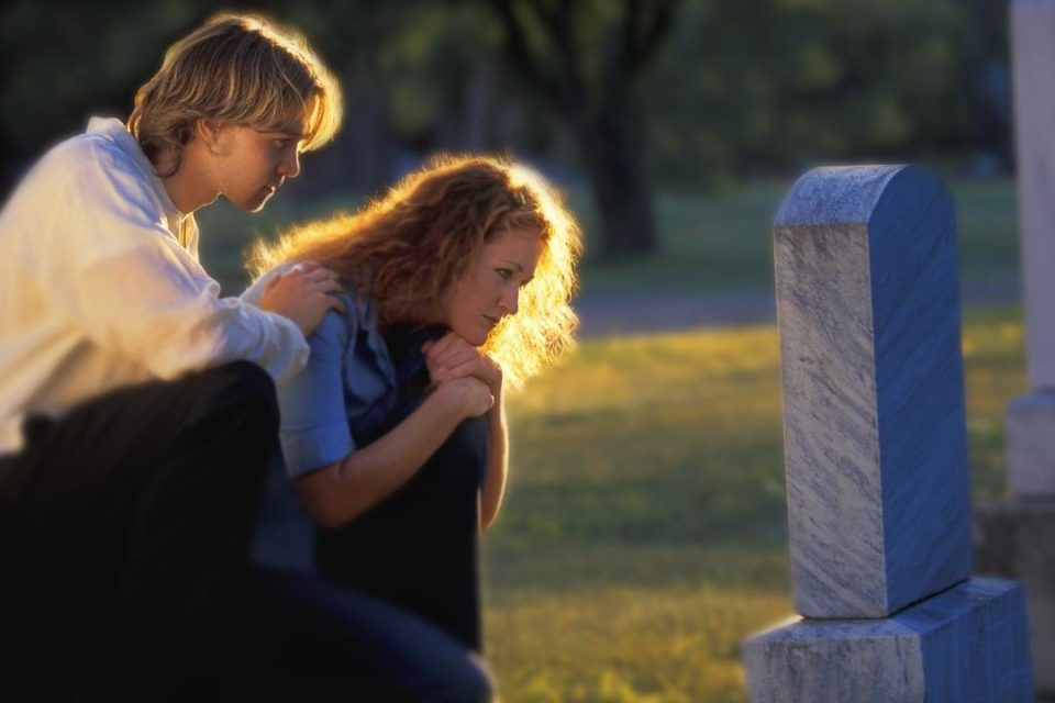 Grief Recovery two people at gravesite