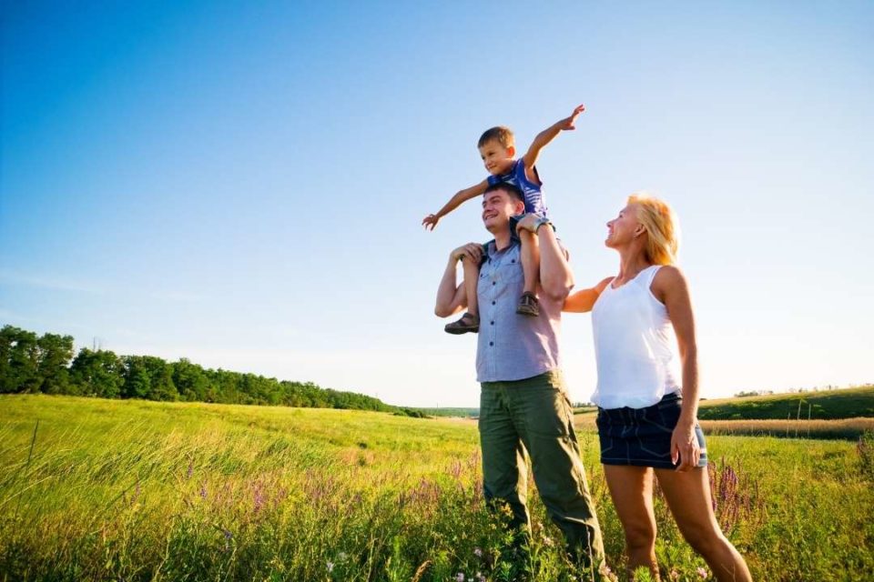 happy family in field