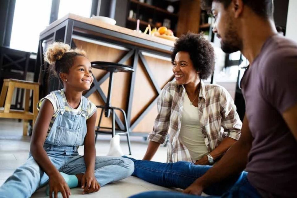 How to Help Your Child Cope With BIG Feelings black girl sitting on floor with parents