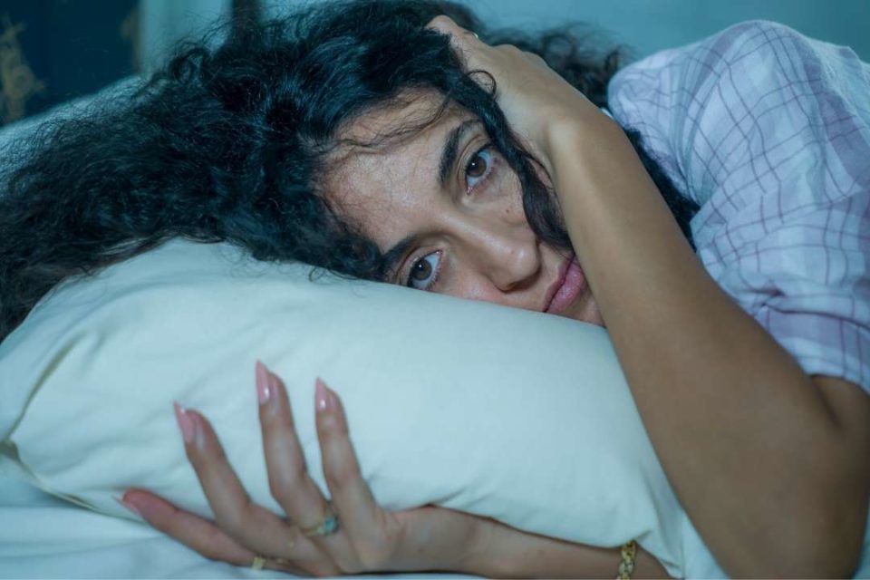 trauma therapy sad woman in bed