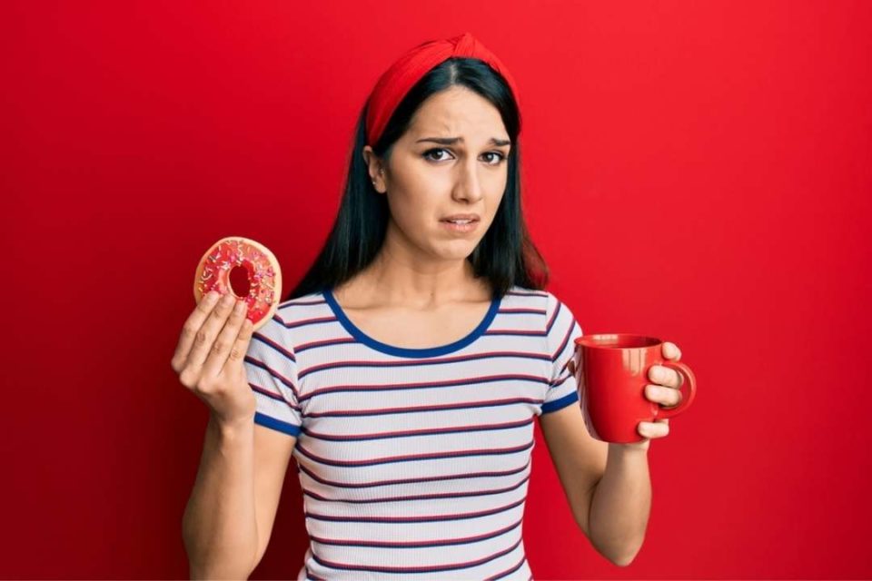 Woman eating doughnuts