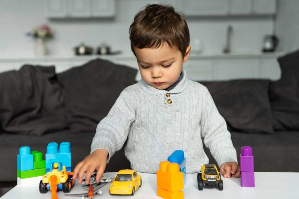 little boy doing play therapy