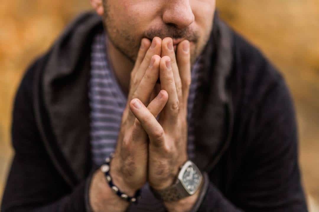 man contemplating but unable to make up his mind