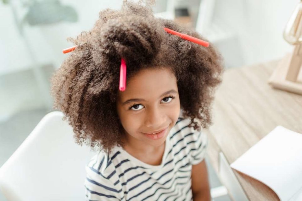 mental health children young black girl with markers in hair