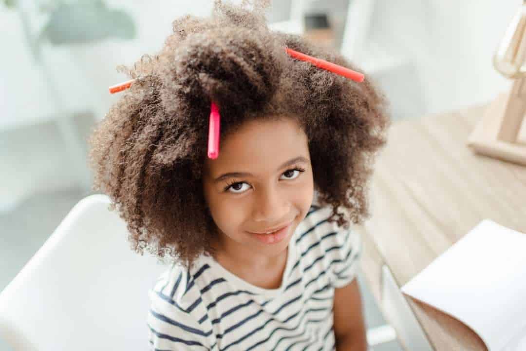 mental health children young black girl with markers in hair