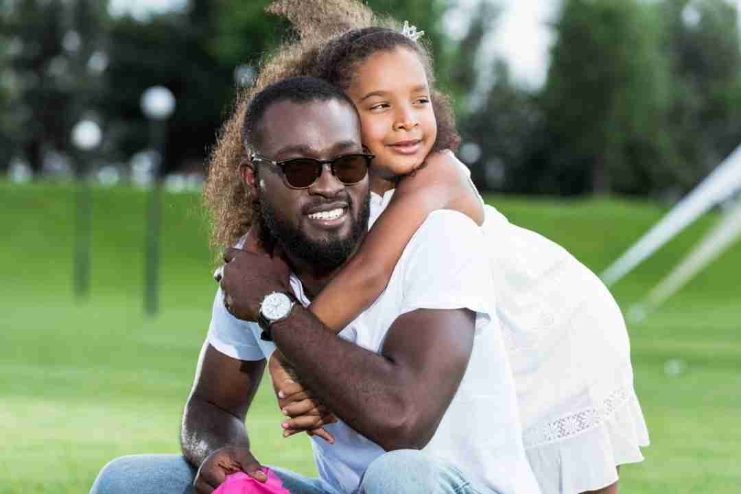 dad and his daughter hugging