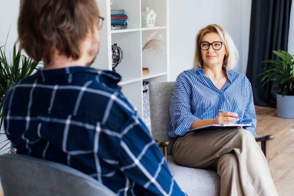 Man talking to his therapist on his people pleasing issue