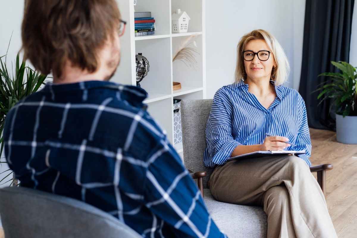 Man talking to his therapist on his people pleasing issue