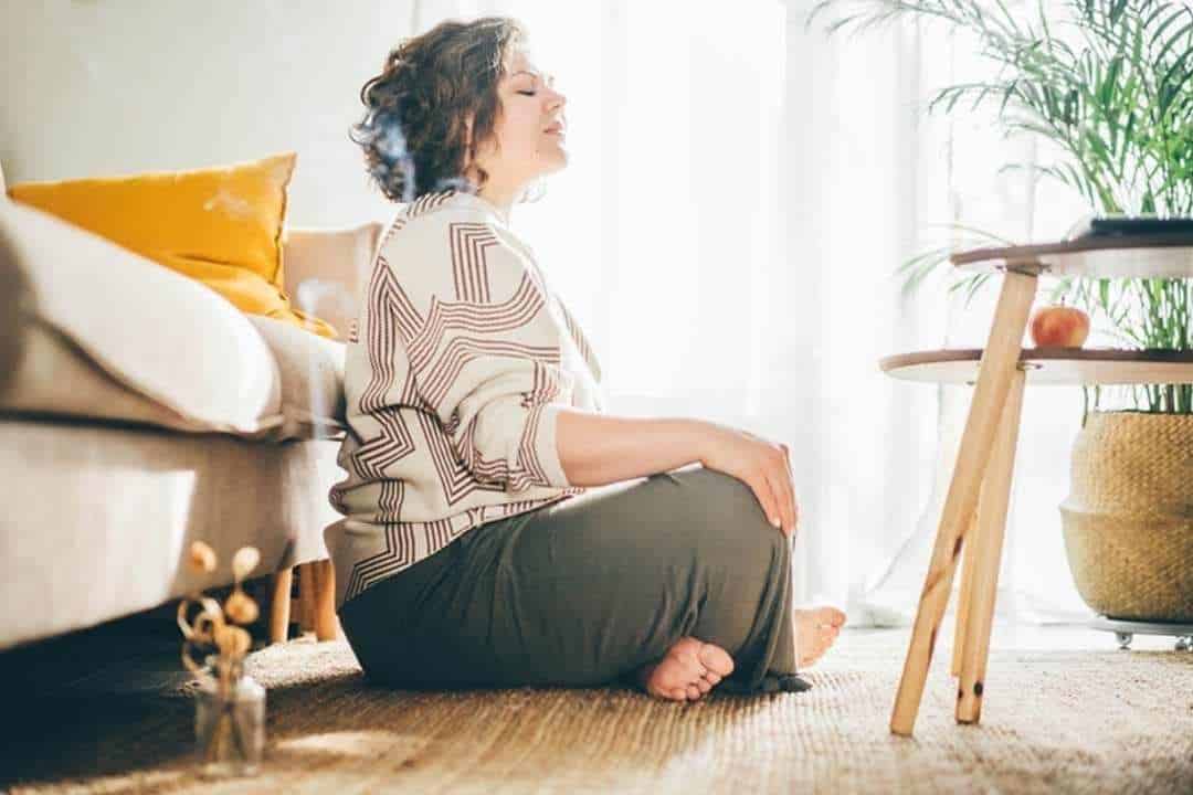 Somatic Therapy Techniques to Add to Your Daily Life white woman meditating