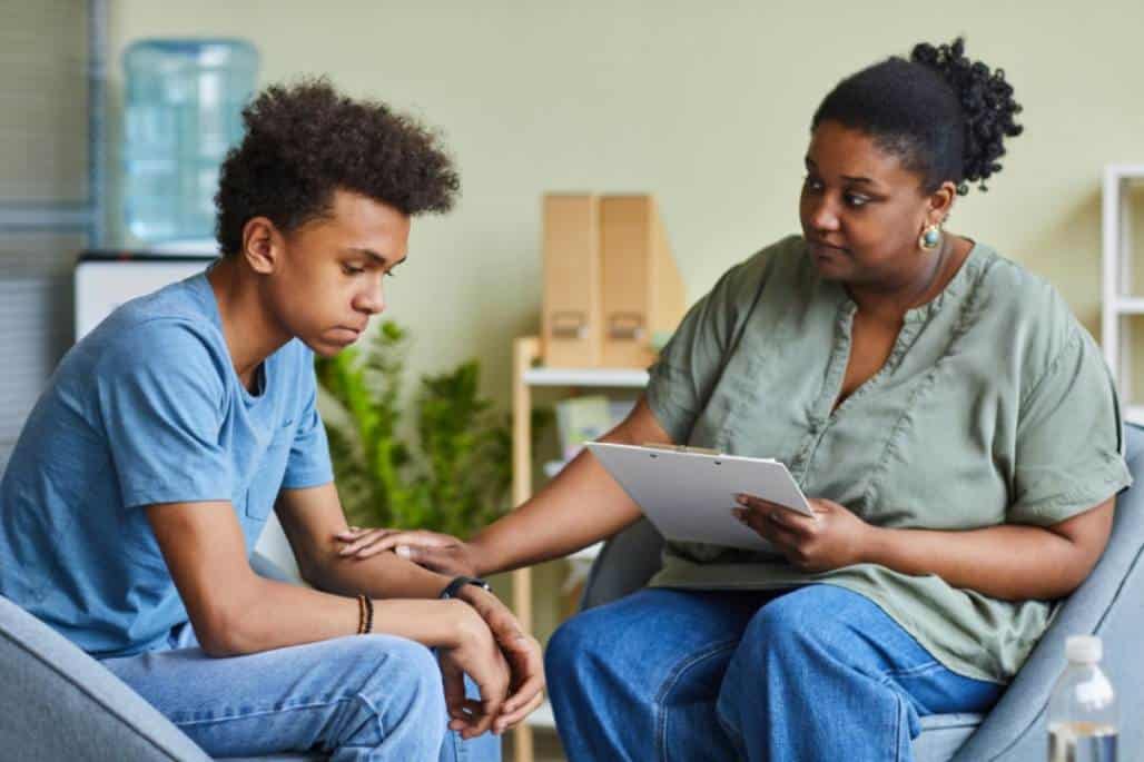 Teenage boy going through teen therapy