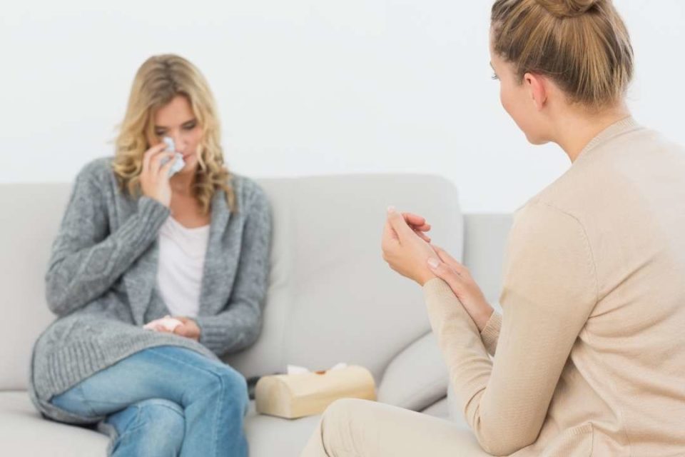 woman crying at therapist office