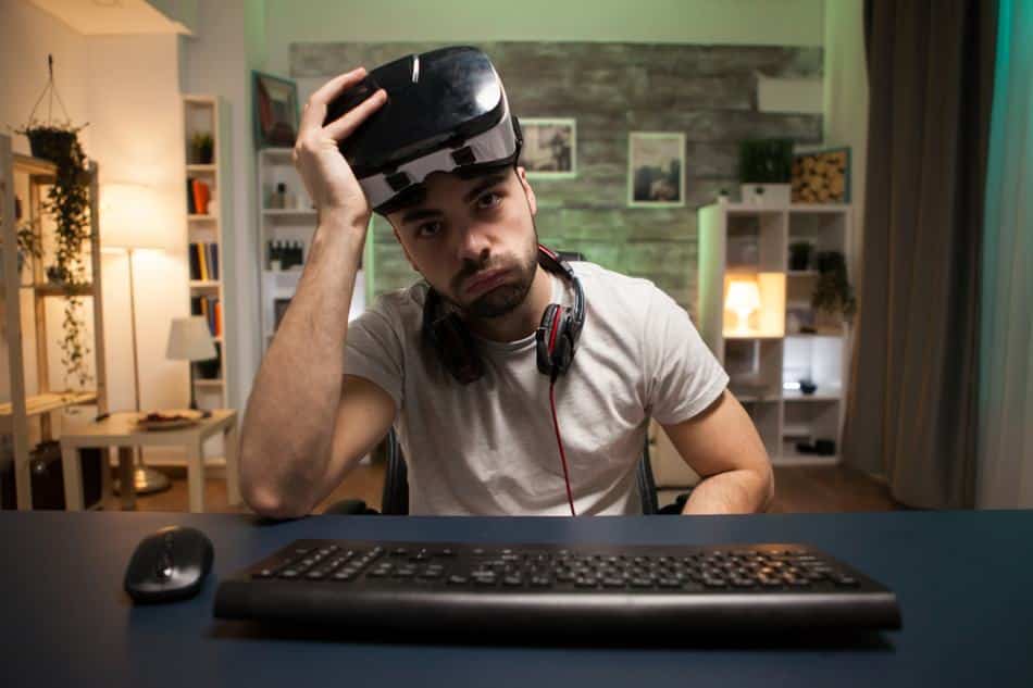 Man using technology that affects his mental health