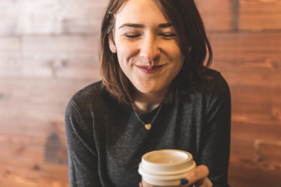 woman smiling cup of coffee self-care