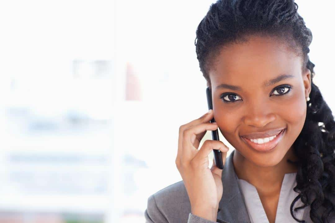 career accomplishments professional smiling black woman on cellphone