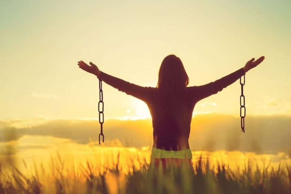 What Self-Harm Is & How Self-Harm Happens woman unchained in field