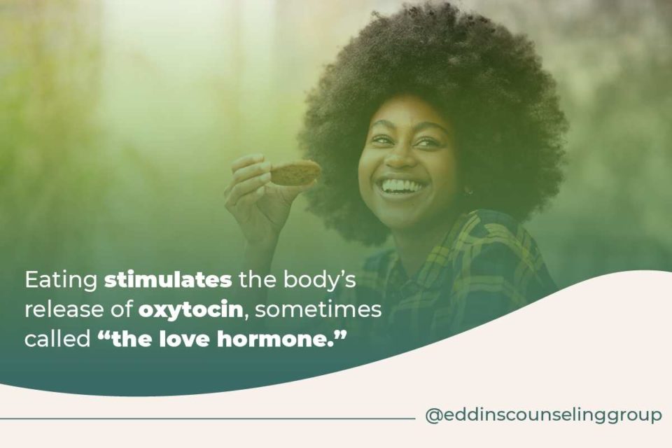 smiling black woman who is very happy eating love hormones