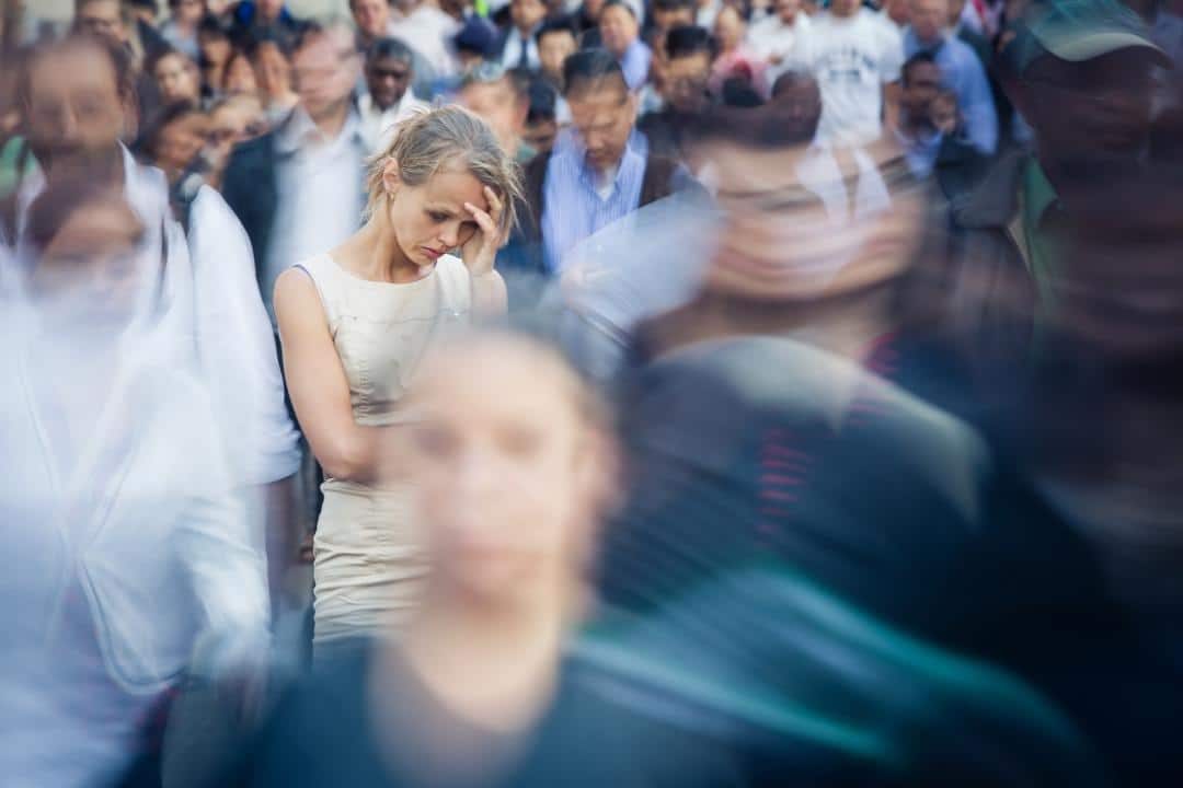Image of a woman in a crowed looking stressed. In anxiety treatment in Houston, TX we can answer "what is an anxiety disorder". We also offer anxiety treatment in Sugar Land, TX 77478. If you think you suffer from anxiety disorder contact our anxiety therapist in Houston, TX 77019. Call today!