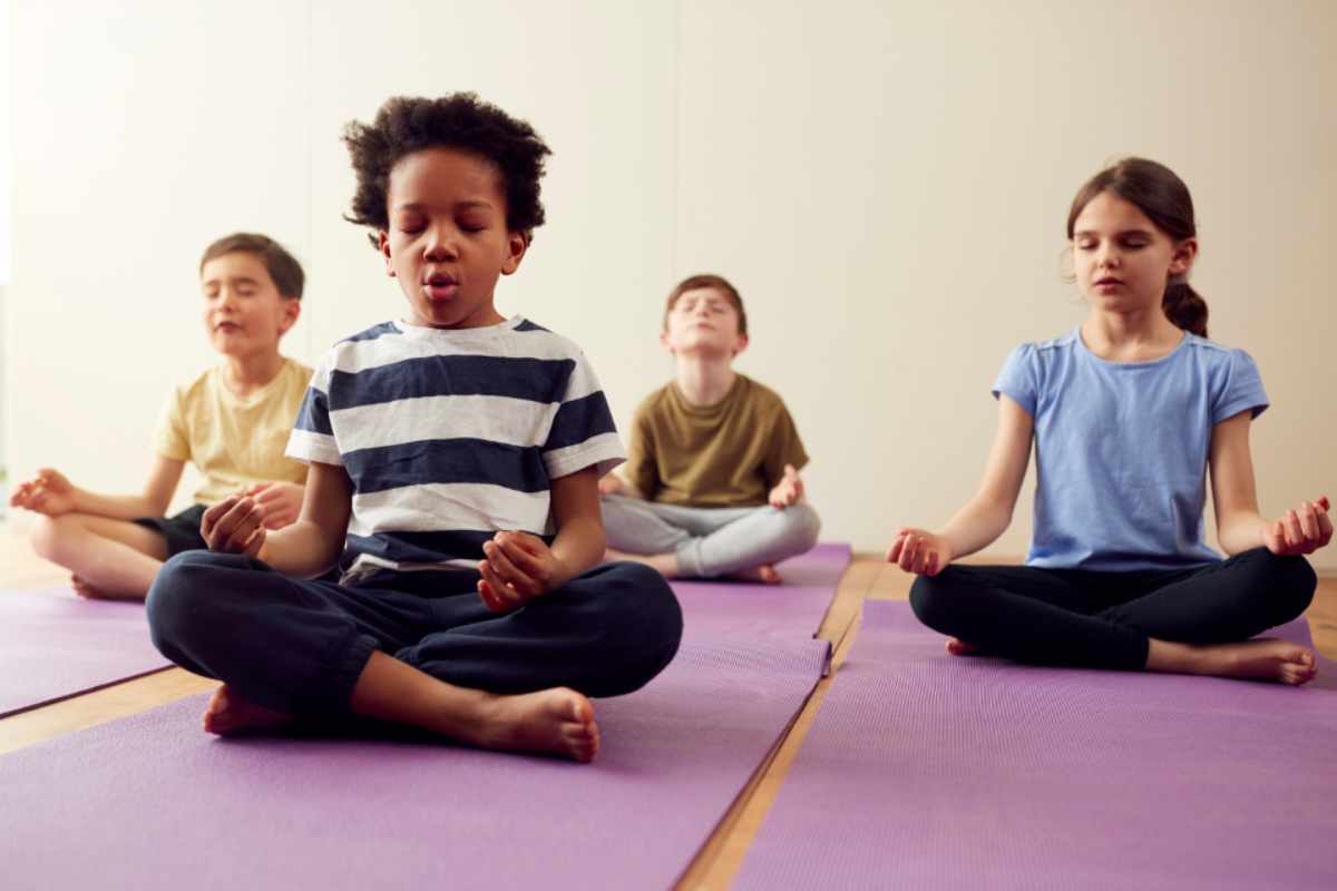 children practicing breathing exercises to calm child's anger
