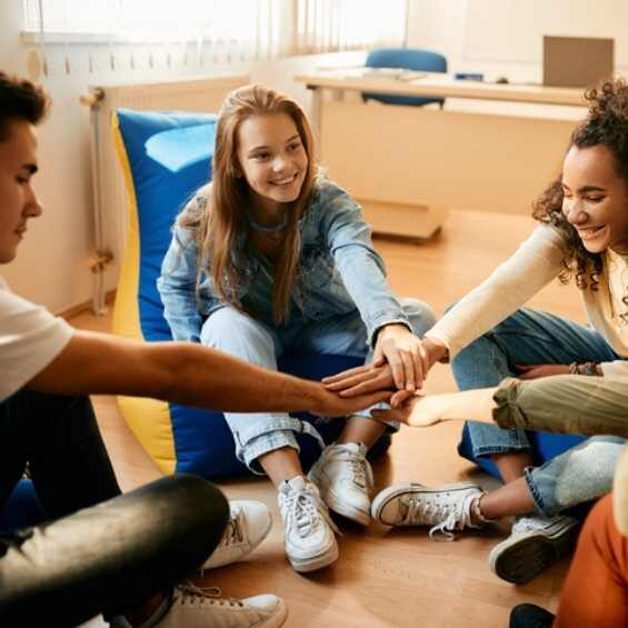 group of teens processing trauma and grief in a therapy group