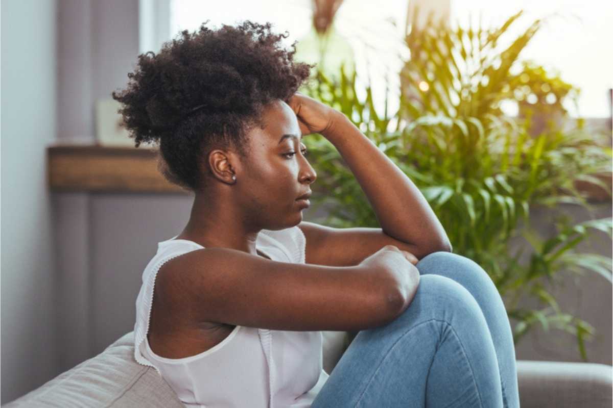 black woman sad from complex ptsd racism and trauma