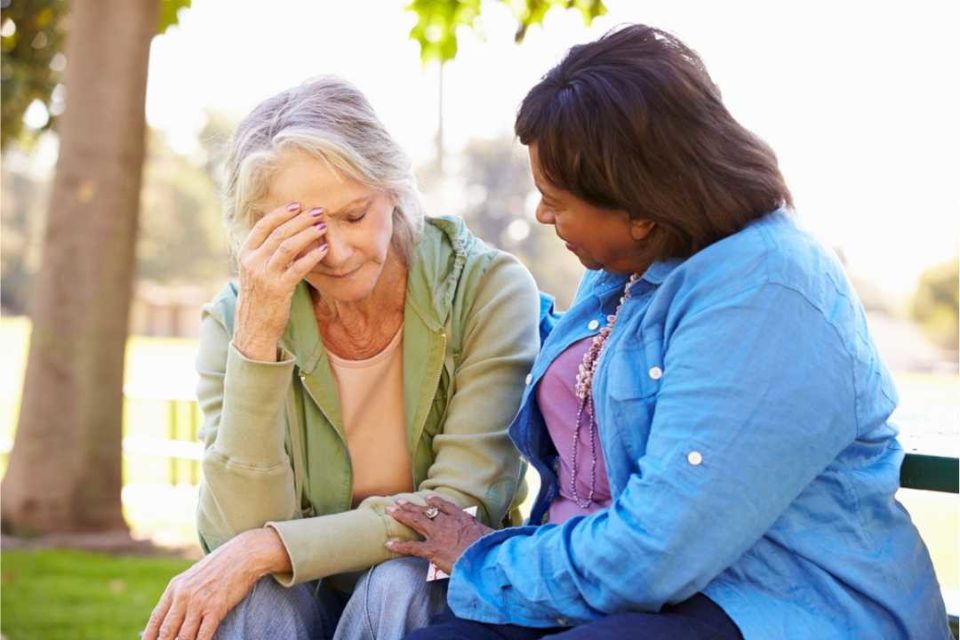 comforting woman with unresolved grief