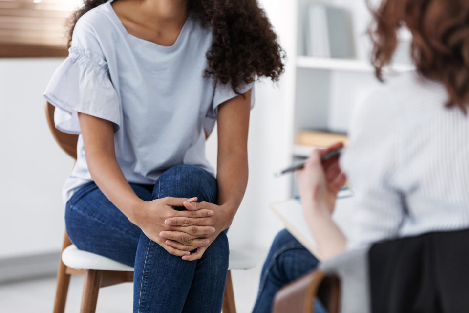 Image of a woman sitting in a therapy session. Are you trying to find a therapist in Sugar Land, TX 77469? Searching for a "therapist near me"? Contact Eddins Counseling Group to find the right fit in a Houston therapist. Call today!
